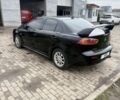 Чорний Міцубісі Lancer, об'ємом двигуна 2 л та пробігом 260 тис. км за 696749 $, фото 1 на Automoto.ua
