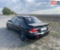 Черный Мицубиси Лансер, объемом двигателя 1.58 л и пробегом 193 тыс. км за 4000 $, фото 6 на Automoto.ua