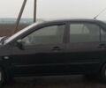 Черный Мицубиси Лансер, объемом двигателя 1.6 л и пробегом 320 тыс. км за 4000 $, фото 1 на Automoto.ua