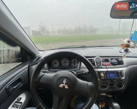 Черный Мицубиси Лансер, объемом двигателя 1.58 л и пробегом 211 тыс. км за 6333 $, фото 28 на Automoto.ua