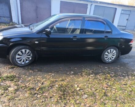 Черный Мицубиси Лансер, объемом двигателя 1.6 л и пробегом 243 тыс. км за 3200 $, фото 2 на Automoto.ua