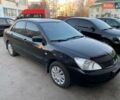 Черный Мицубиси Лансер, объемом двигателя 1.58 л и пробегом 250 тыс. км за 4900 $, фото 1 на Automoto.ua