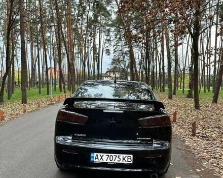 Черный Мицубиси Лансер, объемом двигателя 2 л и пробегом 216 тыс. км за 5600 $, фото 4 на Automoto.ua