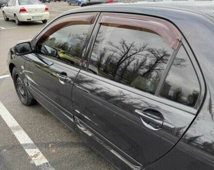 Чорний Міцубісі Lancer, об'ємом двигуна 1.6 л та пробігом 245 тис. км за 4500 $, фото 12 на Automoto.ua