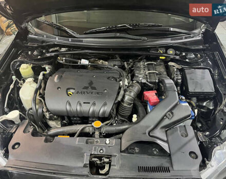 Черный Мицубиси Лансер, объемом двигателя 2 л и пробегом 200 тыс. км за 8000 $, фото 24 на Automoto.ua