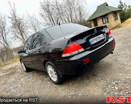 Черный Мицубиси Лансер, объемом двигателя 1.6 л и пробегом 216 тыс. км за 5190 $, фото 2 на Automoto.ua