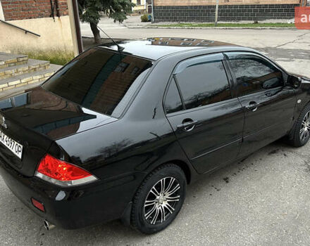 Чорний Міцубісі Lancer, об'ємом двигуна 1.58 л та пробігом 167 тис. км за 4800 $, фото 3 на Automoto.ua