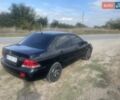 Черный Мицубиси Лансер, объемом двигателя 1.58 л и пробегом 193 тыс. км за 4000 $, фото 9 на Automoto.ua