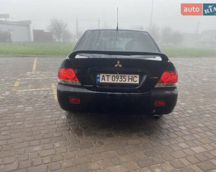 Черный Мицубиси Лансер, объемом двигателя 1.58 л и пробегом 211 тыс. км за 6333 $, фото 7 на Automoto.ua