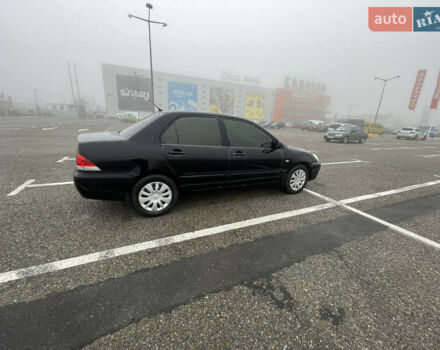 Черный Мицубиси Лансер, объемом двигателя 1.58 л и пробегом 214 тыс. км за 4400 $, фото 3 на Automoto.ua