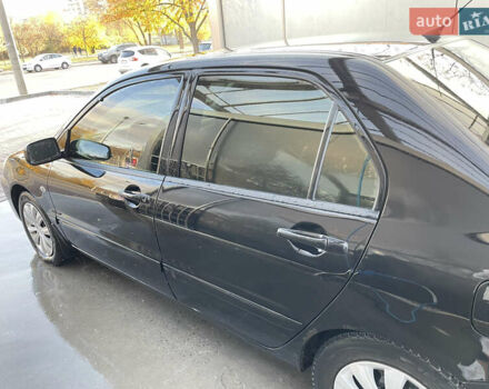 Черный Мицубиси Лансер, объемом двигателя 1.59 л и пробегом 348 тыс. км за 4200 $, фото 2 на Automoto.ua