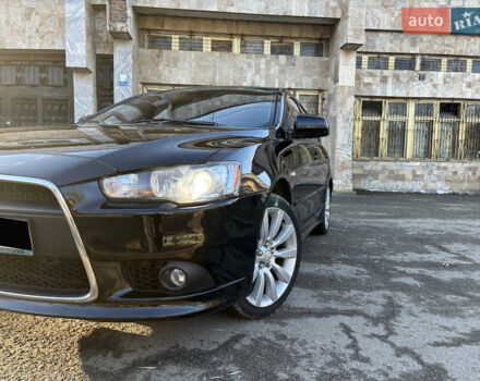 Черный Мицубиси Лансер, объемом двигателя 2 л и пробегом 236 тыс. км за 6450 $, фото 2 на Automoto.ua