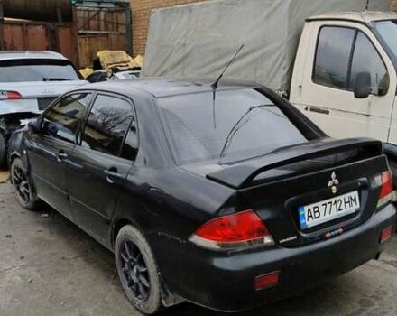 Черный Мицубиси Лансер, объемом двигателя 1.6 л и пробегом 200 тыс. км за 2000 $, фото 4 на Automoto.ua