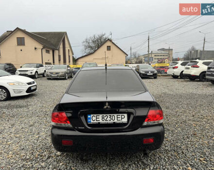 Черный Мицубиси Лансер, объемом двигателя 1.58 л и пробегом 202 тыс. км за 4100 $, фото 16 на Automoto.ua