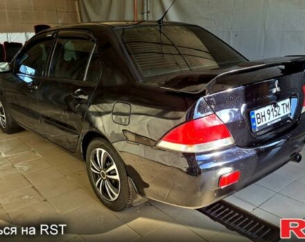 Черный Мицубиси Лансер, объемом двигателя 1.6 л и пробегом 205 тыс. км за 5500 $, фото 3 на Automoto.ua