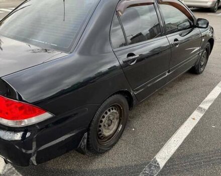 Чорний Міцубісі Lancer, об'ємом двигуна 1.6 л та пробігом 245 тис. км за 4500 $, фото 4 на Automoto.ua