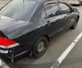 Чорний Міцубісі Lancer, об'ємом двигуна 1.6 л та пробігом 245 тис. км за 4500 $, фото 4 на Automoto.ua