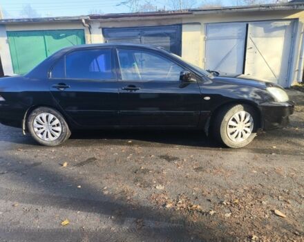 Черный Мицубиси Лансер, объемом двигателя 1.6 л и пробегом 243 тыс. км за 3200 $, фото 6 на Automoto.ua