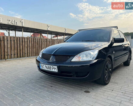 Чорний Міцубісі Lancer, об'ємом двигуна 1.58 л та пробігом 237 тис. км за 4500 $, фото 1 на Automoto.ua