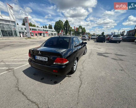 Чорний Міцубісі Lancer, об'ємом двигуна 1.6 л та пробігом 292 тис. км за 3600 $, фото 4 на Automoto.ua
