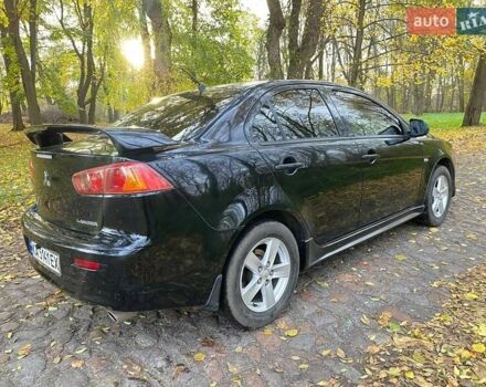 Чорний Міцубісі Lancer, об'ємом двигуна 2 л та пробігом 237 тис. км за 7500 $, фото 9 на Automoto.ua