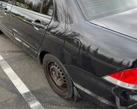 Чорний Міцубісі Lancer, об'ємом двигуна 1.6 л та пробігом 245 тис. км за 4500 $, фото 10 на Automoto.ua