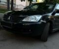 Чорний Міцубісі Lancer, об'ємом двигуна 1.6 л та пробігом 486 тис. км за 3600 $, фото 1 на Automoto.ua