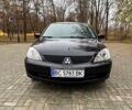 Черный Мицубиси Лансер, объемом двигателя 1.6 л и пробегом 185 тыс. км за 5500 $, фото 2 на Automoto.ua