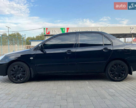 Чорний Міцубісі Lancer, об'ємом двигуна 1.58 л та пробігом 237 тис. км за 4500 $, фото 3 на Automoto.ua