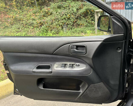 Чорний Міцубісі Lancer, об'ємом двигуна 1.58 л та пробігом 192 тис. км за 4500 $, фото 13 на Automoto.ua