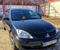 Чорний Міцубісі Lancer, об'ємом двигуна 1.6 л та пробігом 183 тис. км за 4150 $, фото 1 на Automoto.ua