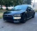 Черный Мицубиси Лансер, объемом двигателя 2 л и пробегом 290 тыс. км за 4850 $, фото 1 на Automoto.ua