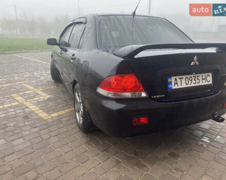 Черный Мицубиси Лансер, объемом двигателя 1.58 л и пробегом 211 тыс. км за 6333 $, фото 9 на Automoto.ua