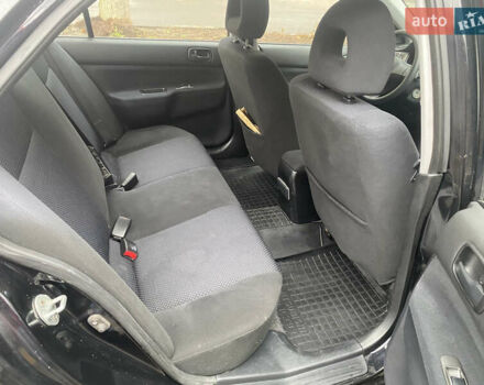 Черный Мицубиси Лансер, объемом двигателя 1.6 л и пробегом 143 тыс. км за 3000 $, фото 7 на Automoto.ua