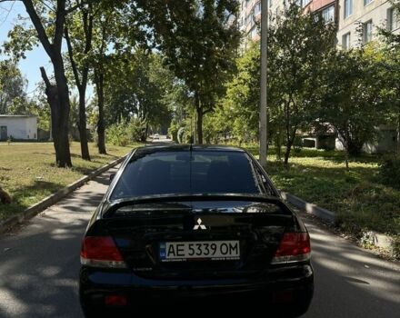 Черный Мицубиси Лансер, объемом двигателя 1.6 л и пробегом 184 тыс. км за 3700 $, фото 4 на Automoto.ua