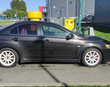 Чорний Міцубісі Lancer, об'ємом двигуна 2 л та пробігом 134 тис. км за 29034 $, фото 1 на Automoto.ua