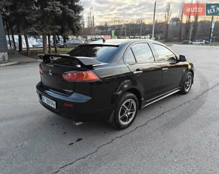 Черный Мицубиси Лансер, объемом двигателя 2 л и пробегом 245 тыс. км за 5600 $, фото 4 на Automoto.ua