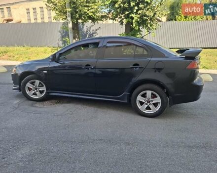 Черный Мицубиси Лансер, объемом двигателя 2 л и пробегом 230 тыс. км за 7000 $, фото 18 на Automoto.ua