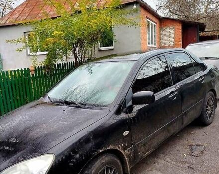 Черный Мицубиси Лансер, объемом двигателя 1.6 л и пробегом 126 тыс. км за 4500 $, фото 1 на Automoto.ua