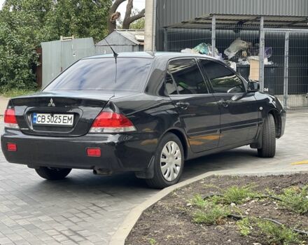 Черный Мицубиси Лансер, объемом двигателя 1.6 л и пробегом 168 тыс. км за 5662 $, фото 3 на Automoto.ua