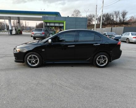 Черный Мицубиси Лансер, объемом двигателя 2 л и пробегом 245 тыс. км за 5600 $, фото 1 на Automoto.ua