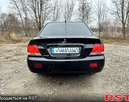 Черный Мицубиси Лансер, объемом двигателя 1.6 л и пробегом 216 тыс. км за 5190 $, фото 3 на Automoto.ua