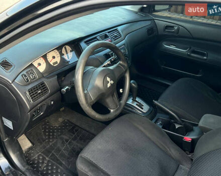Чорний Міцубісі Lancer, об'ємом двигуна 1.58 л та пробігом 237 тис. км за 4500 $, фото 13 на Automoto.ua