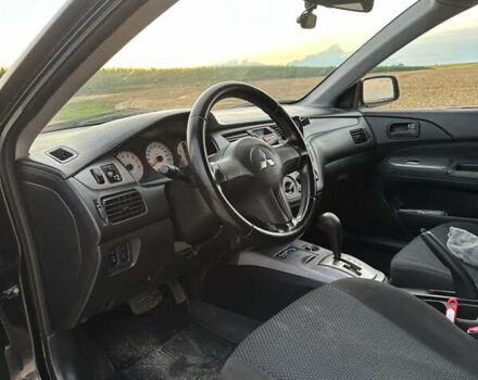 Чорний Міцубісі Lancer, об'ємом двигуна 1.58 л та пробігом 232 тис. км за 4300 $, фото 13 на Automoto.ua