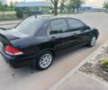 Черный Мицубиси Лансер, объемом двигателя 1.6 л и пробегом 245 тыс. км за 4034 $, фото 1 на Automoto.ua