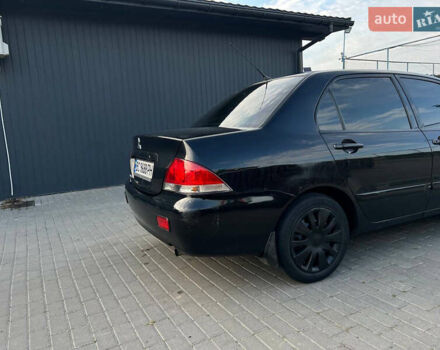 Чорний Міцубісі Lancer, об'ємом двигуна 1.58 л та пробігом 237 тис. км за 4500 $, фото 8 на Automoto.ua
