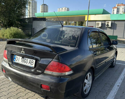 Черный Мицубиси Лансер, объемом двигателя 1.58 л и пробегом 364 тыс. км за 3000 $, фото 2 на Automoto.ua