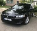 Черный Мицубиси Лансер, объемом двигателя 2 л и пробегом 280 тыс. км за 5833 $, фото 1 на Automoto.ua