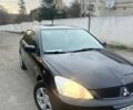 Чорний Міцубісі Lancer, об'ємом двигуна 1.58 л та пробігом 218 тис. км за 4800 $, фото 1 на Automoto.ua