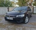 Чорний Міцубісі Lancer, об'ємом двигуна 2 л та пробігом 207 тис. км за 6416 $, фото 1 на Automoto.ua